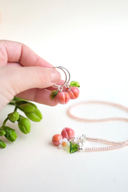 Lampwork glass peach earrings on silver hoops